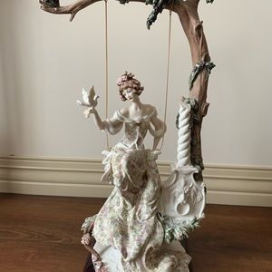 Giuseppe Armani lady in swing Italian figurine mint condition.